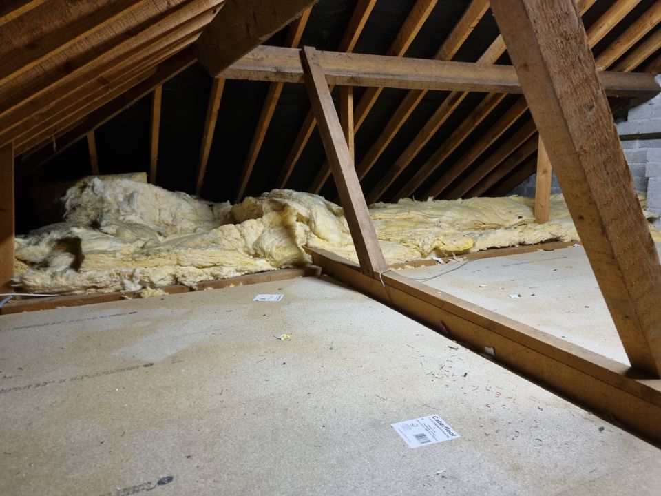 Attic cleared down to the insulation and joists