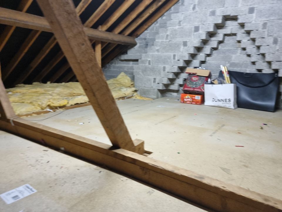 The same attic after the clearance, emptied and swept