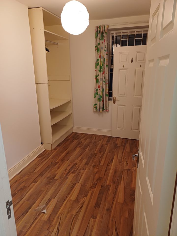 The same bedroom after the clearance, emptied and swept