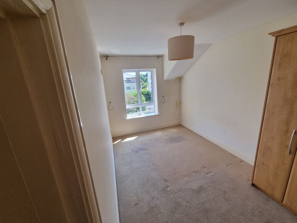 The same bedroom after the clearance, emptied and swept