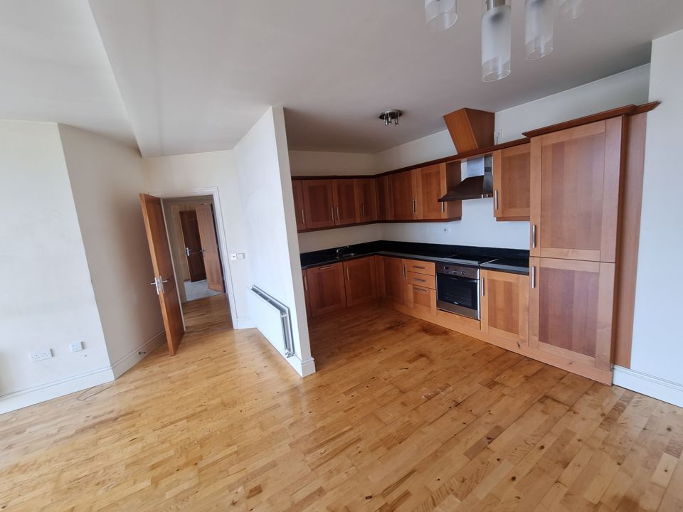 The same kitchen after the clearance, emptied and swept