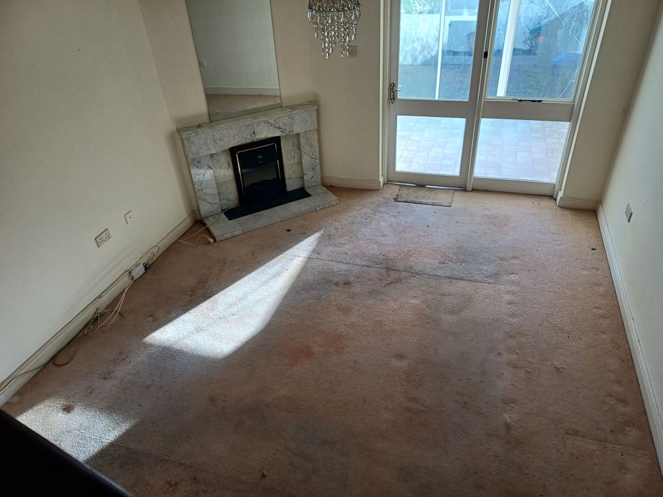The same sitting room after the clearance, emptied and swept