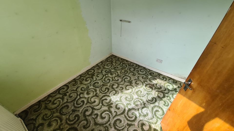 The same green bedroom cleared down to the carpet, Sutton