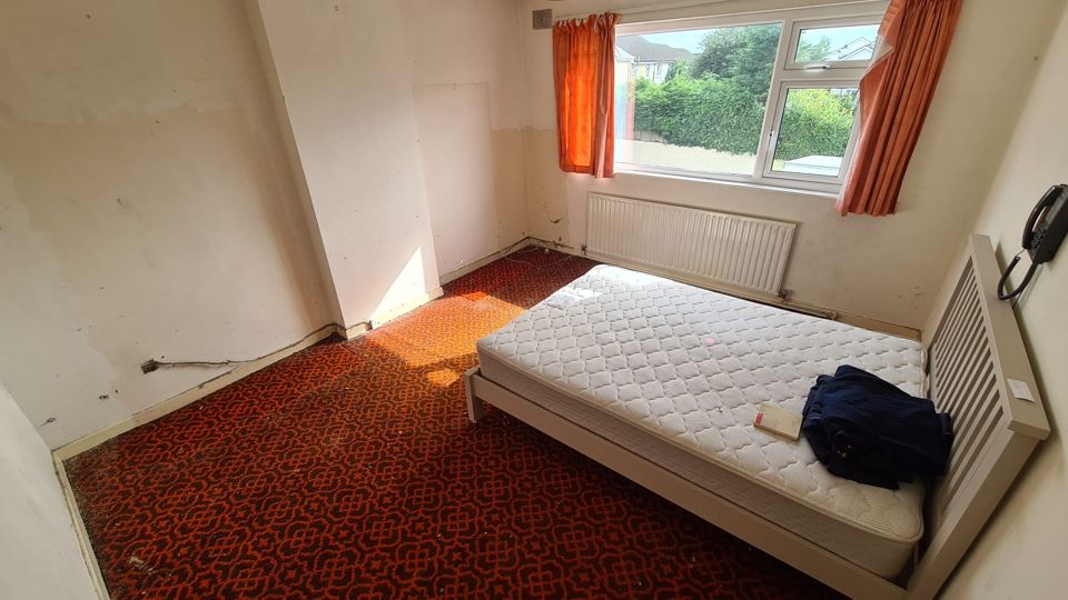 The same bedroom after clearance, with only the bed left, Sutton